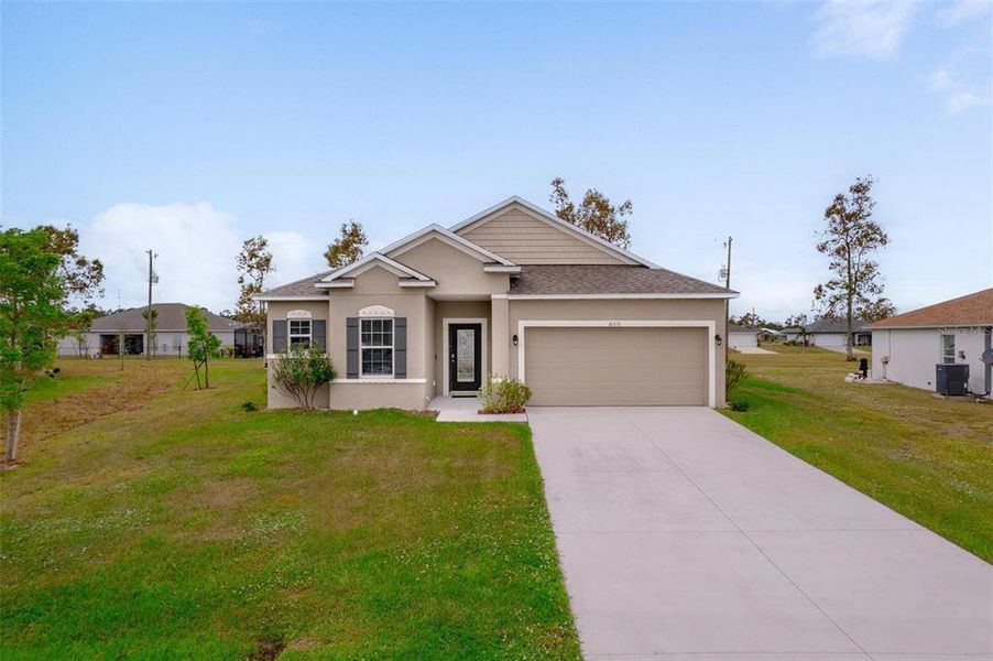 Front exterior of a new home in , Punta Gorda, FL, highlighting curb appeal (Image 22). Front exterior of a new home in , Punta Gorda, FL, highlighting curb appeal (Image 22).