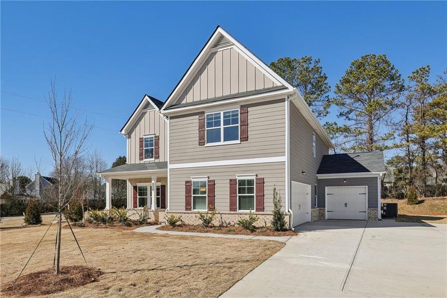Front exterior of a new home in Stephen's Landing, Loganville, GA, highlighting curb appeal (Image 21).