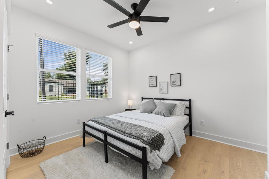 Secondary bedroom on the first floor with an ensuite bathroom, offering convenience, privacy, and a perfect layout for family members or guests.
