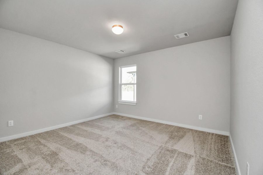 Another view of the secondary bedroom. Sample photo of completed home with similar floor plan. Actual colors and selections may vary. Another view of the secondary bedroom. Sample photo of completed home with similar floor plan. Actual colors and selections may vary.