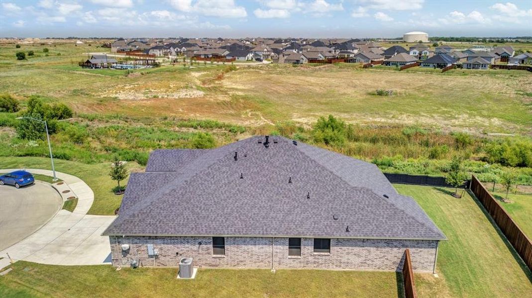 View from above of property that shows all the green space that surrounds the house.