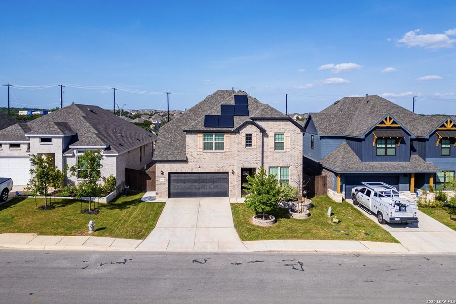 Front exterior of a new home in Bison Ridge, San Antonio, TX, highlighting curb appeal (Image 25).