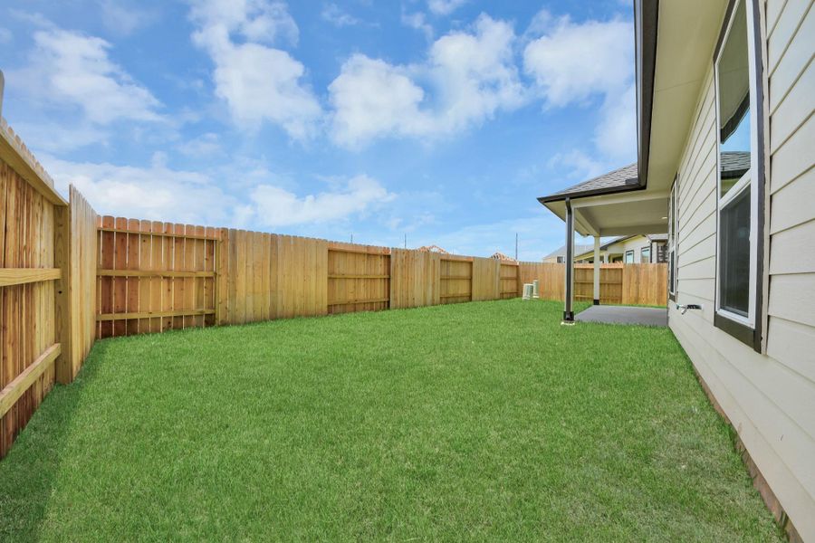 Discover the charm of this spacious backyard featuring a delightful covered patio. With ample room for both play and relaxation, it's the perfect outdoor haven. Tailor this space to your liking with patio furniture, a BBQ pit, and more. The potential for creating your dream outdoor living area is limitless! Discover the charm of this spacious backyard featuring a delightful covered patio. With ample room for both play and relaxation, it's the perfect outdoor haven. Tailor this space to your liking with patio furniture, a BBQ pit, and more. The potential for creating your dream outdoor living area is limitless!