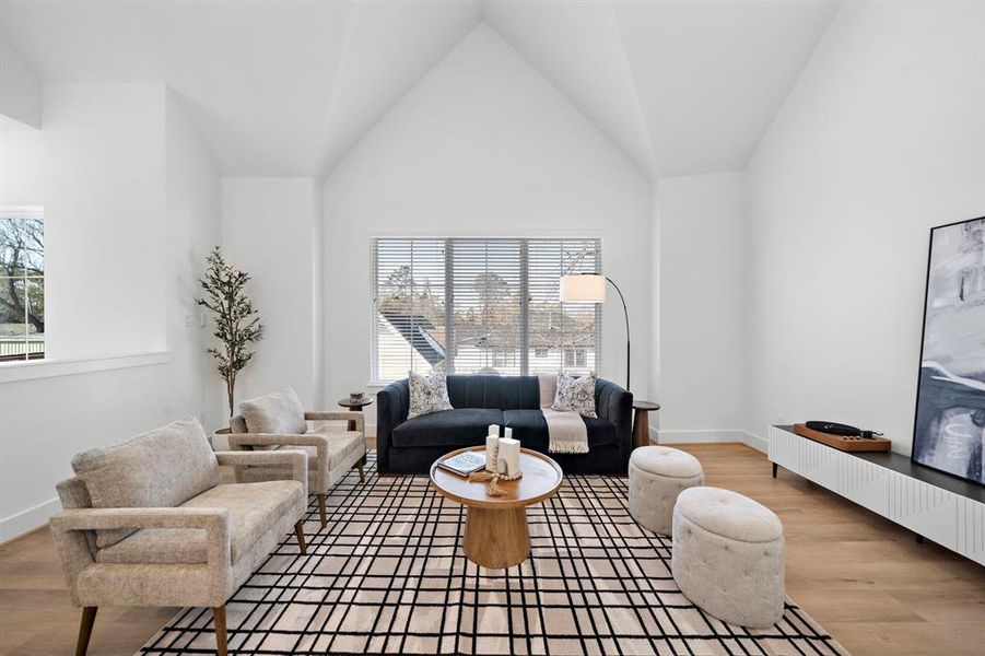 Second floor living room has soaring 16 foot ceilings and flooded with natural light!