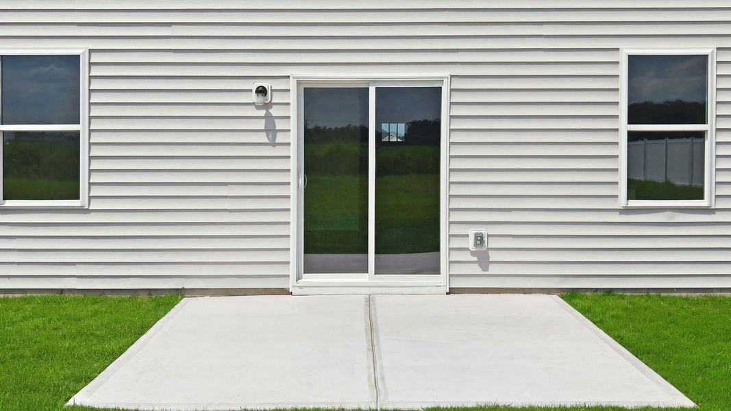 Exterior details and patio area of a home in East Ridge, Ayden (Image 22).