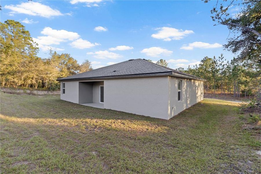 Exterior details and patio area of a home in , Citrus Springs (Image 3).