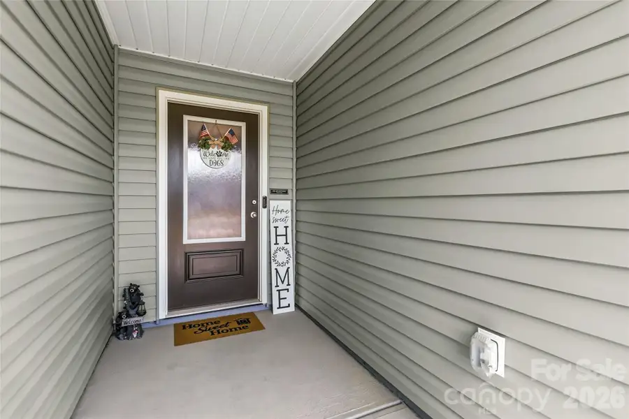 Exterior details and patio area of a home in McKee Creek Village, Charlotte (Image 4).
