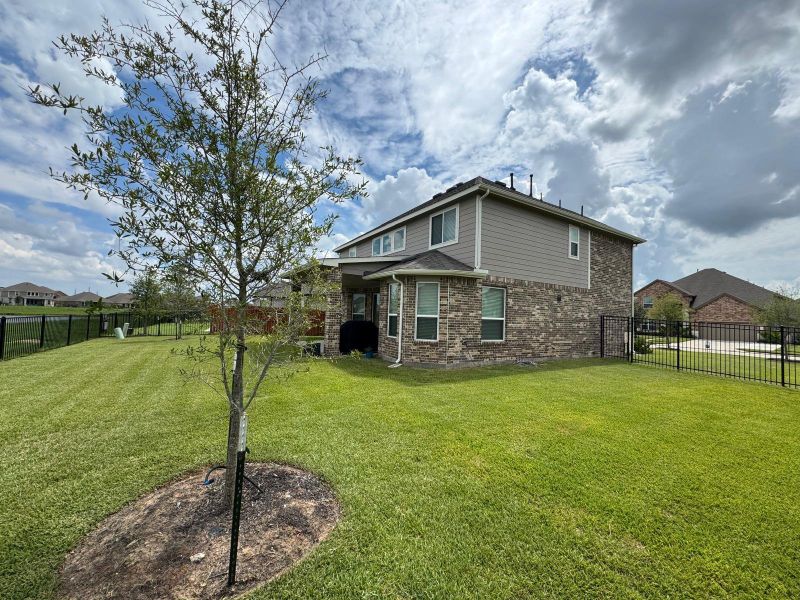 Front exterior of a new home in Rodeo Palms - The Lakes, Manvel, TX, highlighting curb appeal (Image 26). Front exterior of a new home in Rodeo Palms - The Lakes, Manvel, TX, highlighting curb appeal (Image 26).