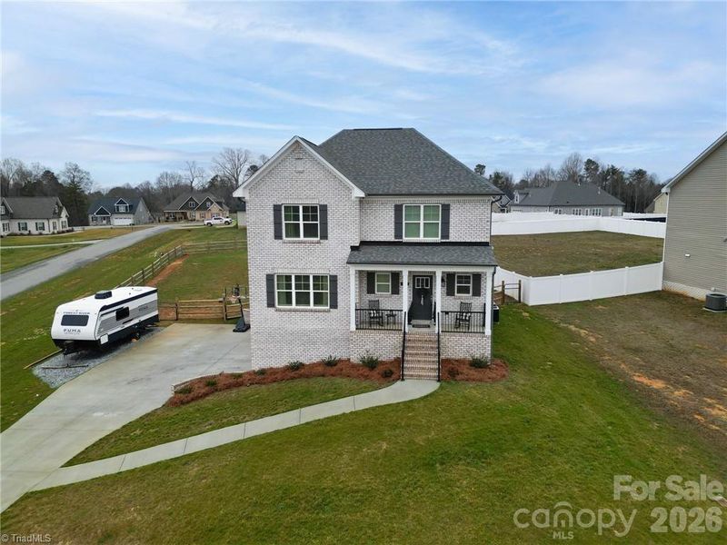 Front exterior of a new home in , Lexington, NC, highlighting curb appeal (Image 22).