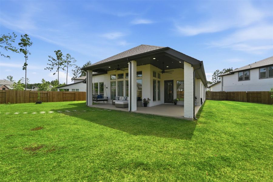 Exterior details and patio area of a home in Artavia, Conroe (Image 28).