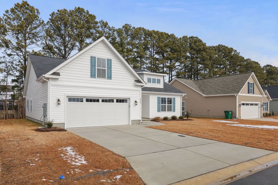 Front exterior of a new home in Davenport Farms, Winterville, NC, highlighting curb appeal (Image 21).