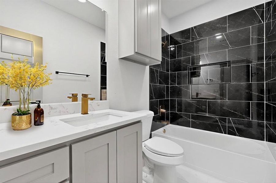 Bathroom with vanity and bathing tub / shower combination