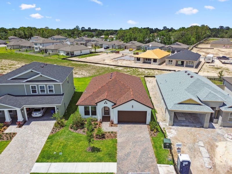 Front exterior of a new home in Avalon West, Spring Hill, FL, highlighting curb appeal (Image 12).