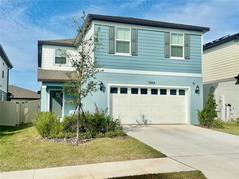 Front exterior of a new home in Silverlake, Lake Alfred, FL, highlighting curb appeal (Image 1). Front exterior of a new home in Silverlake, Lake Alfred, FL, highlighting curb appeal (Image 1).
