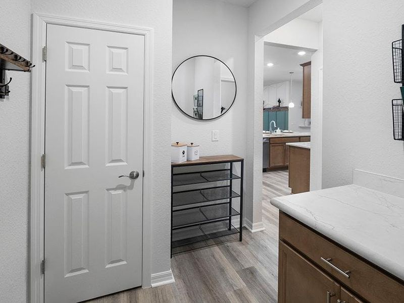 A mud room with a closet at the garage entry provides space for jackets, shoes, and more - Summerlyn II by Highland Homes