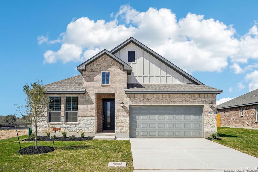 Front exterior of a new home in Carmel Ranch, Schertz, TX, highlighting curb appeal (Image 23).