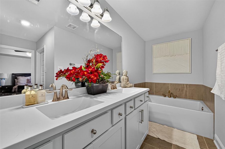 Furnished interior view inside a new home in Sunterra, Katy (Image 16).