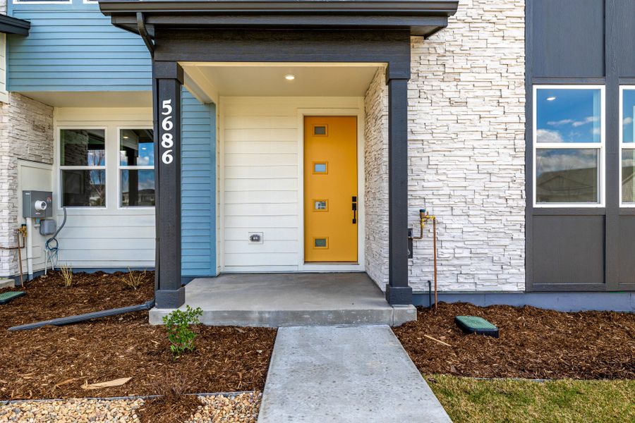Front exterior of a new home in Painted Prairie, Aurora, CO, highlighting curb appeal (Image 24).