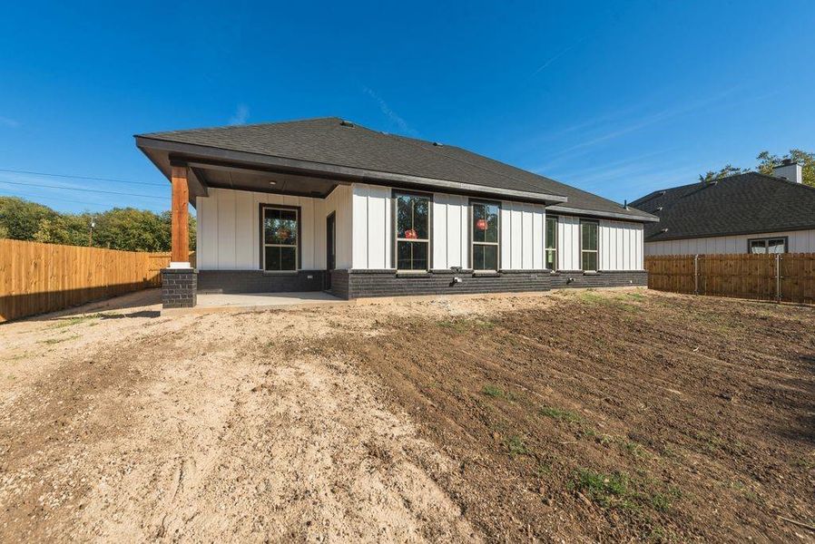 Back of house with a patio