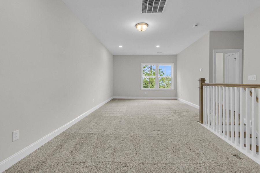 Spacious, unfurnished interior of a new home in Tidewater at Lakes of Cane Bay, Summerville (Image 24). Spacious, unfurnished interior of a new home in Tidewater at Lakes of Cane Bay, Summerville (Image 24).