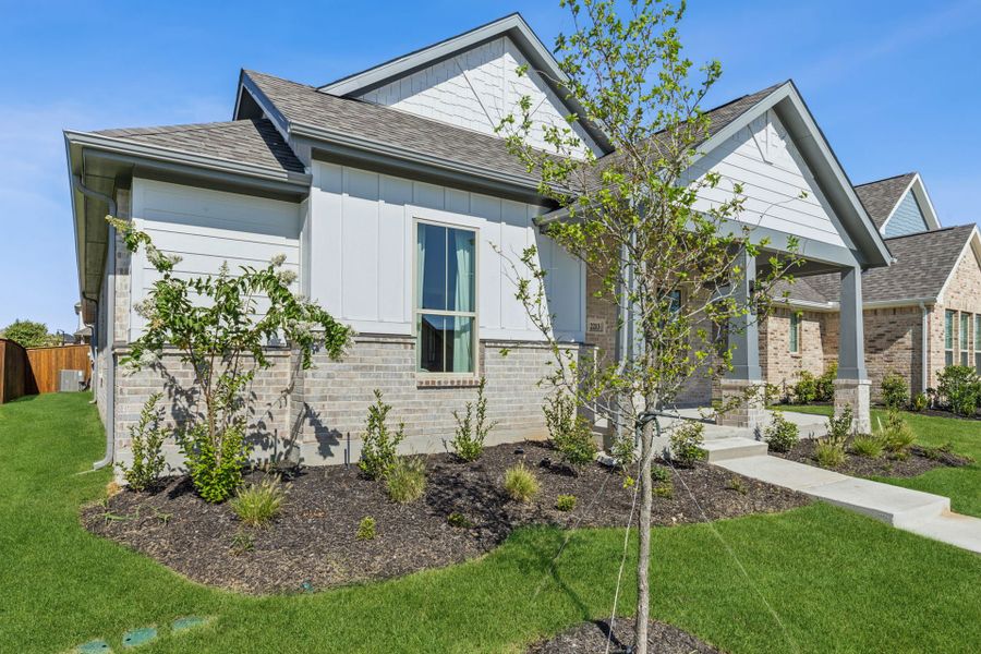 Front exterior of a new home in Dove Hollow, Waxahachie, TX, highlighting curb appeal (Image 2). Front exterior of a new home in Dove Hollow, Waxahachie, TX, highlighting curb appeal (Image 2).