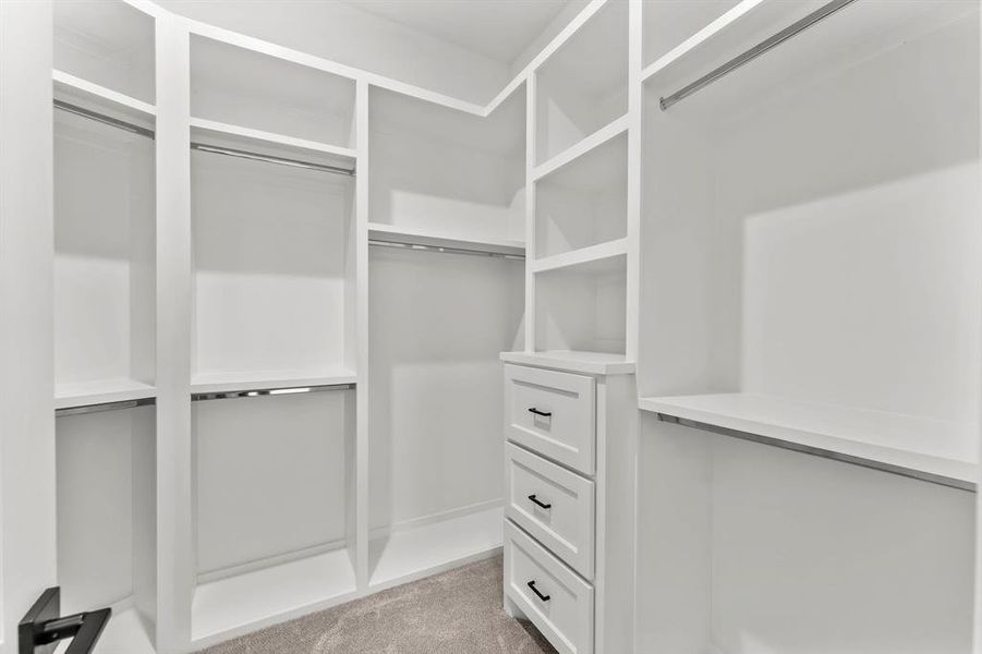 Custom built shelves in both primary closets