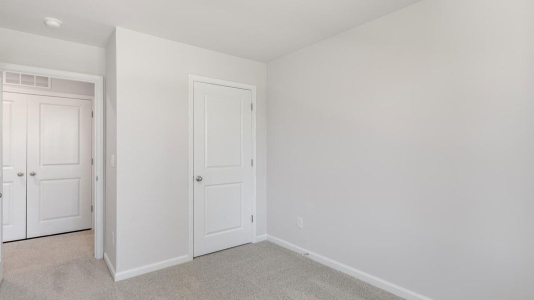 Spacious, unfurnished interior of a new home in The Landing at Sidbury Station, Castle Hayne (Image 32).