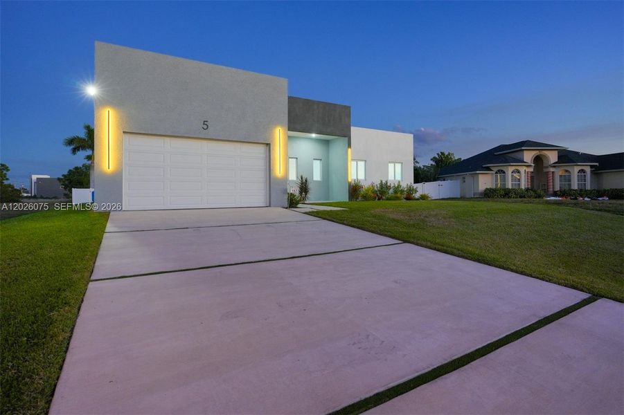 Front exterior of a new home in , Cape Coral, FL, highlighting curb appeal (Image 20).