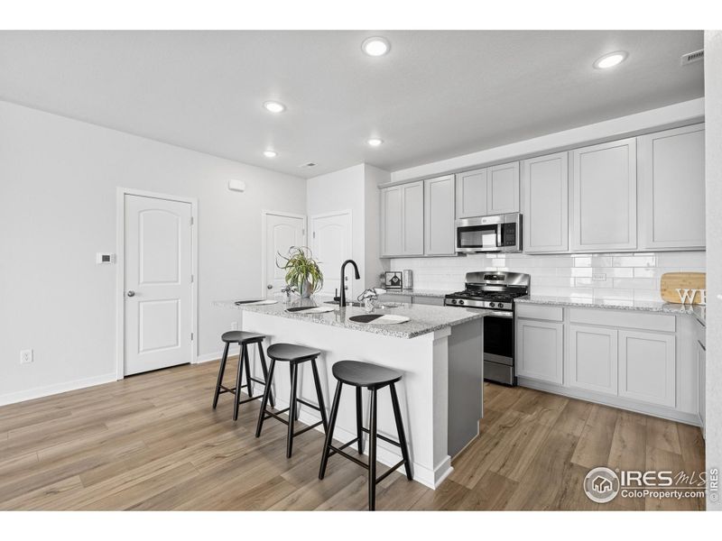 Furnished interior view inside a new home in Kinston Mainstreet Townhomes, Loveland (Image 10). Furnished interior view inside a new home in Kinston Mainstreet Townhomes, Loveland (Image 10).