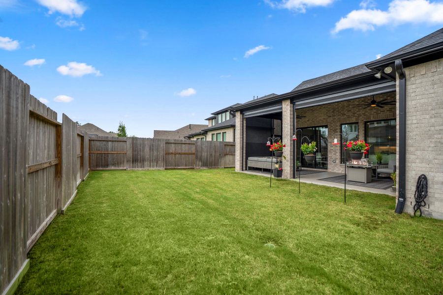 Exterior details and patio area of a home in The Highlands - 65', Porter (Image 24).