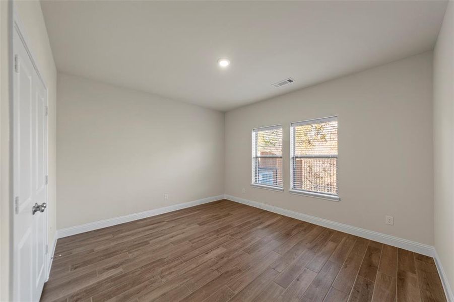 Spare room with light wood-style flooring and recessed lighting