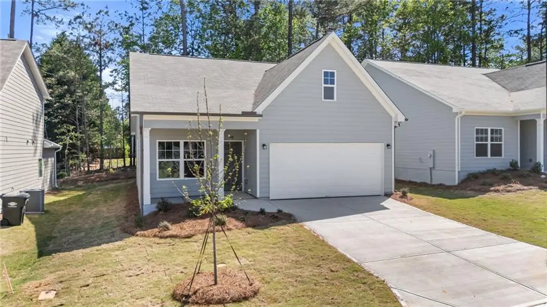 Front exterior of a new home in Villages at Cedar Hill, Dallas, GA, highlighting curb appeal (Image 2).