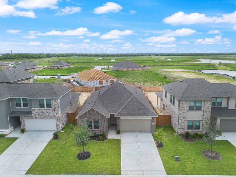 Front exterior of a new home in River Ranch Trails, Dayton, TX, highlighting curb appeal (Image 14).