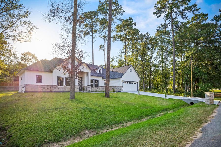 Front exterior of a new home in , Conroe, TX, highlighting curb appeal (Image 22).