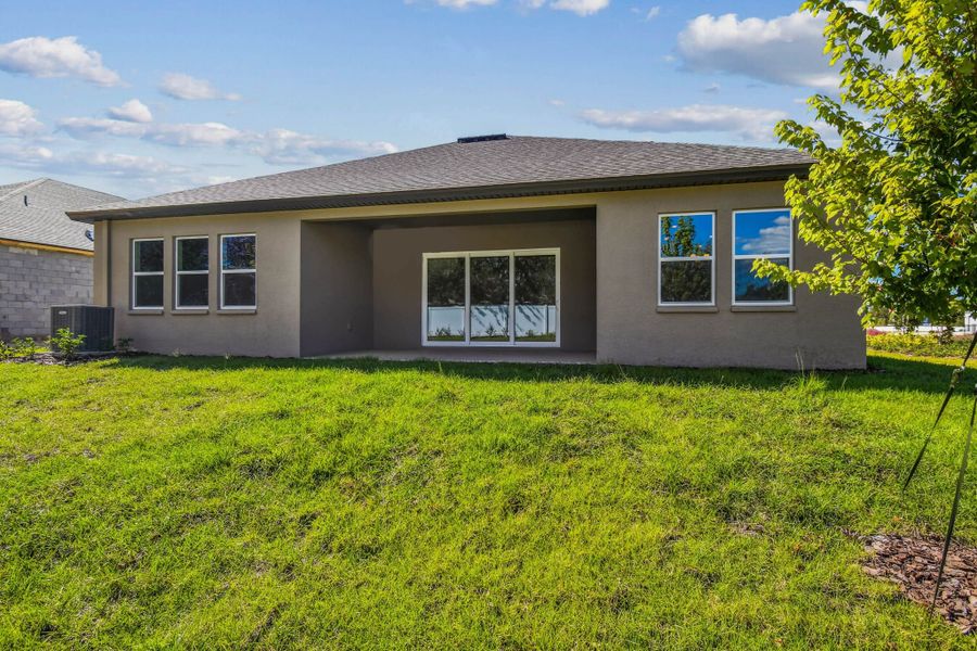 Exterior details and patio area of a home in Pinecone Reserve, Brooksville (Image 34).