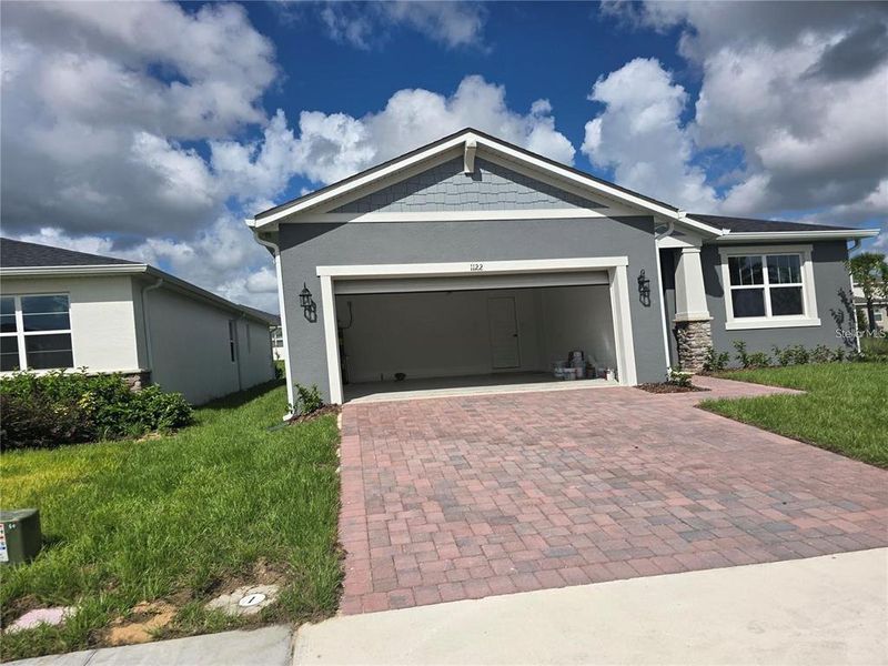 Front exterior of a new home in Soleil, Kissimmee, FL, highlighting curb appeal (Image 1). Front exterior of a new home in Soleil, Kissimmee, FL, highlighting curb appeal (Image 1).