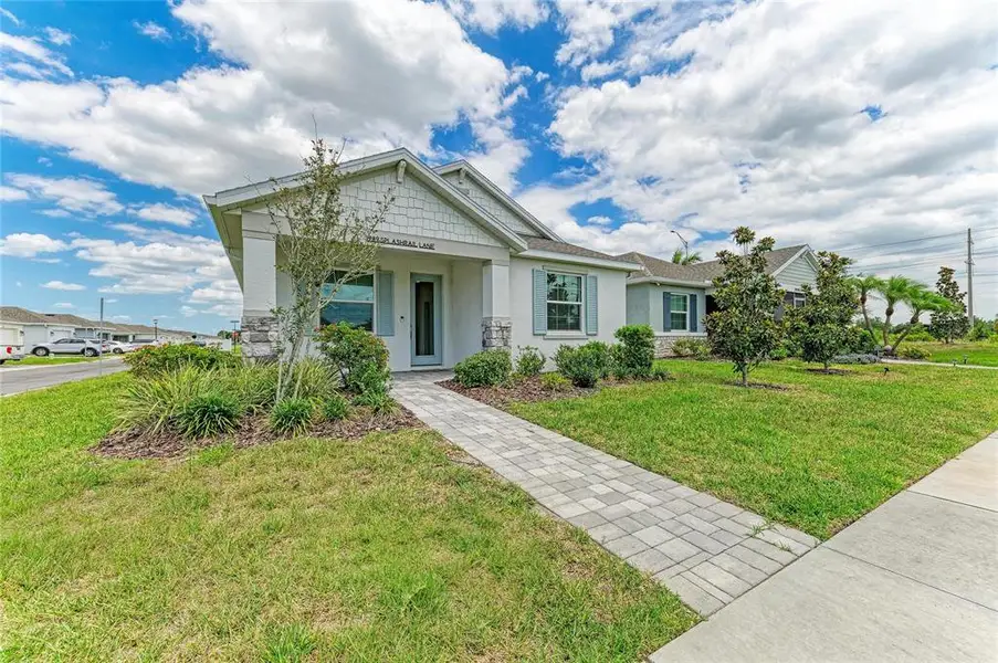 Front exterior of a new home in , Sarasota, FL, highlighting curb appeal (Image 2). Front exterior of a new home in , Sarasota, FL, highlighting curb appeal (Image 2).