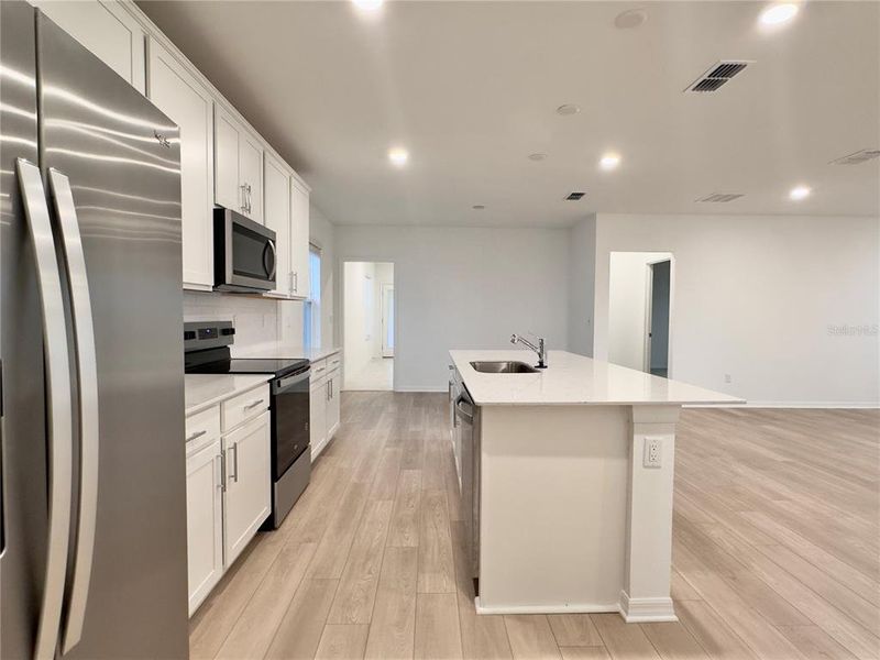 Furnished interior view inside a new home in Parkside Trails, Clermont (Image 12).