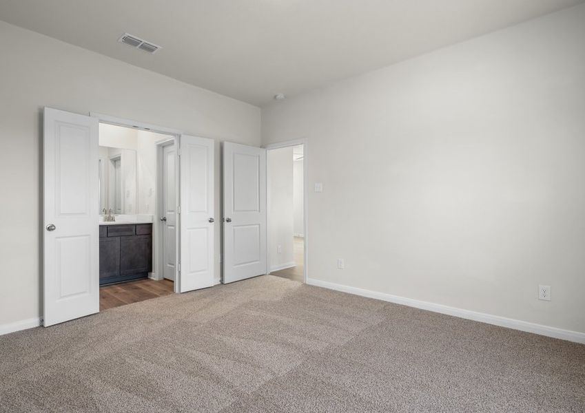 The master suite has a large bedroom, ensuite bathroom and a walk-in closet.