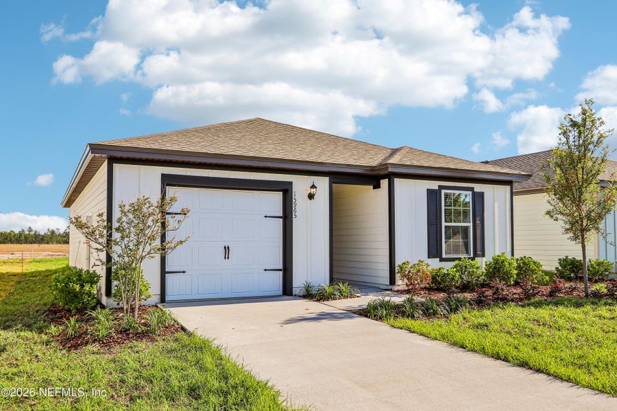 Front exterior of a new home in , Jacksonville, FL, highlighting curb appeal (Image 17).