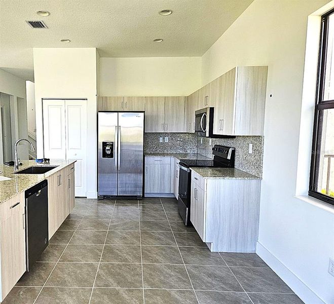 Furnished interior view inside a new home in , Ave Maria (Image 7).