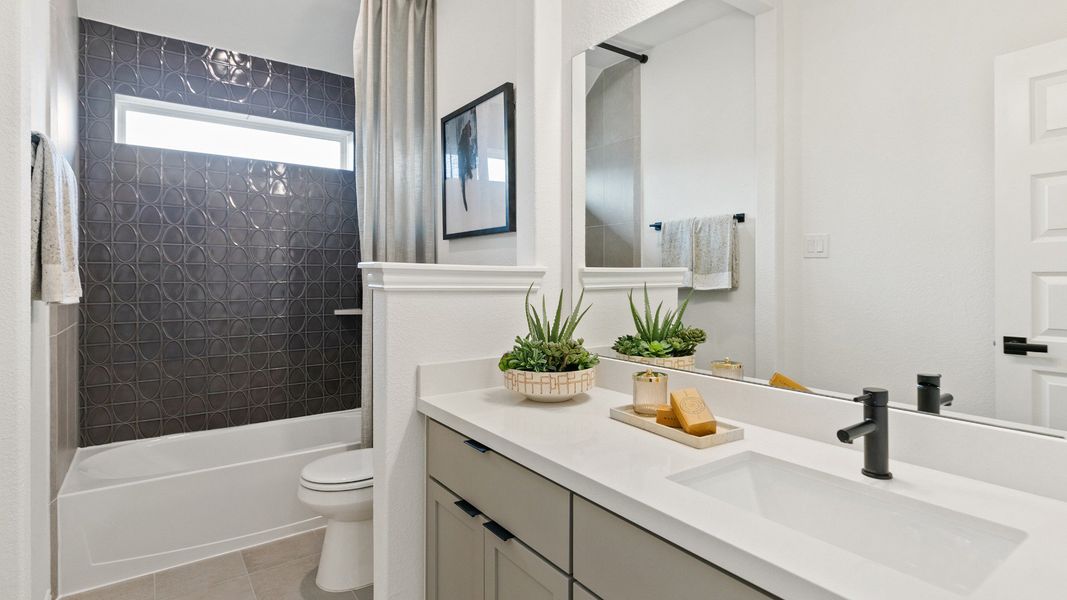 Representative furnished interior of a home built from the Mimosa by Brightland Homes in Sunterra, Katy (Image 25).