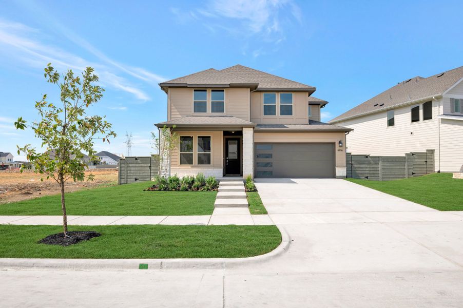 Front exterior of a new home in Landmark, Denton, TX, highlighting curb appeal (Image 1). Front exterior of a new home in Landmark, Denton, TX, highlighting curb appeal (Image 1).