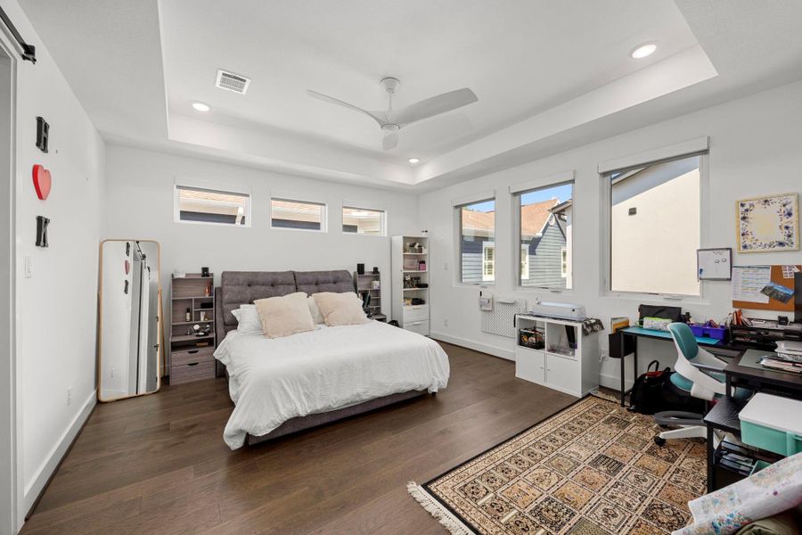 Primary bedroom overlooking pool.