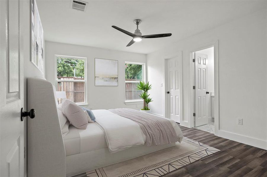 Digitally Staged Primary Bedroom with baseboards, visible vents, dark wood finished floors, and a ceiling fan