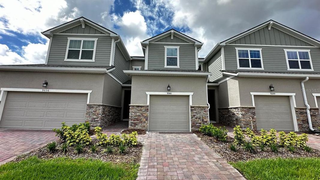 Front exterior of a new home in , Kissimmee, FL, highlighting curb appeal (Image 1). Front exterior of a new home in , Kissimmee, FL, highlighting curb appeal (Image 1).