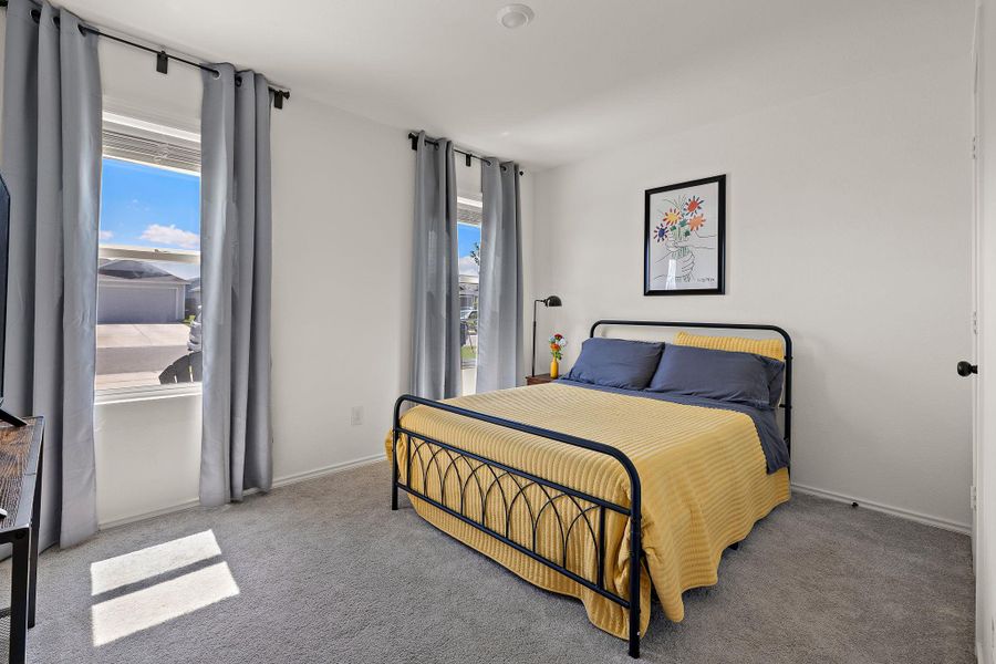 Comfortable secondary bedroom with plenty of natural light. Comfortable secondary bedroom with plenty of natural light.