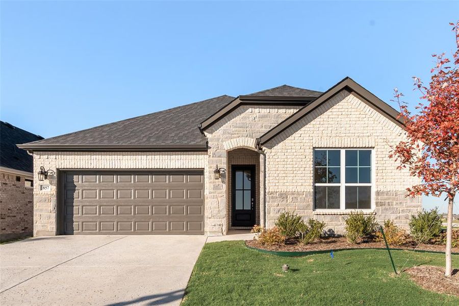 Front exterior of a new home in Wildflower Ranch, Justin, TX, highlighting curb appeal (Image 21).