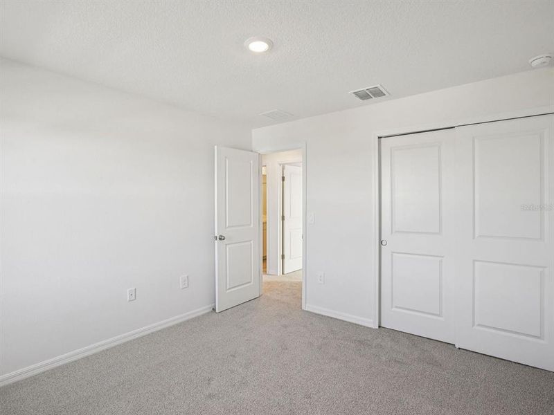 Spacious, unfurnished interior of a new home in The Grove at Stuart Crossing - Classic Series, Bartow (Image 18).