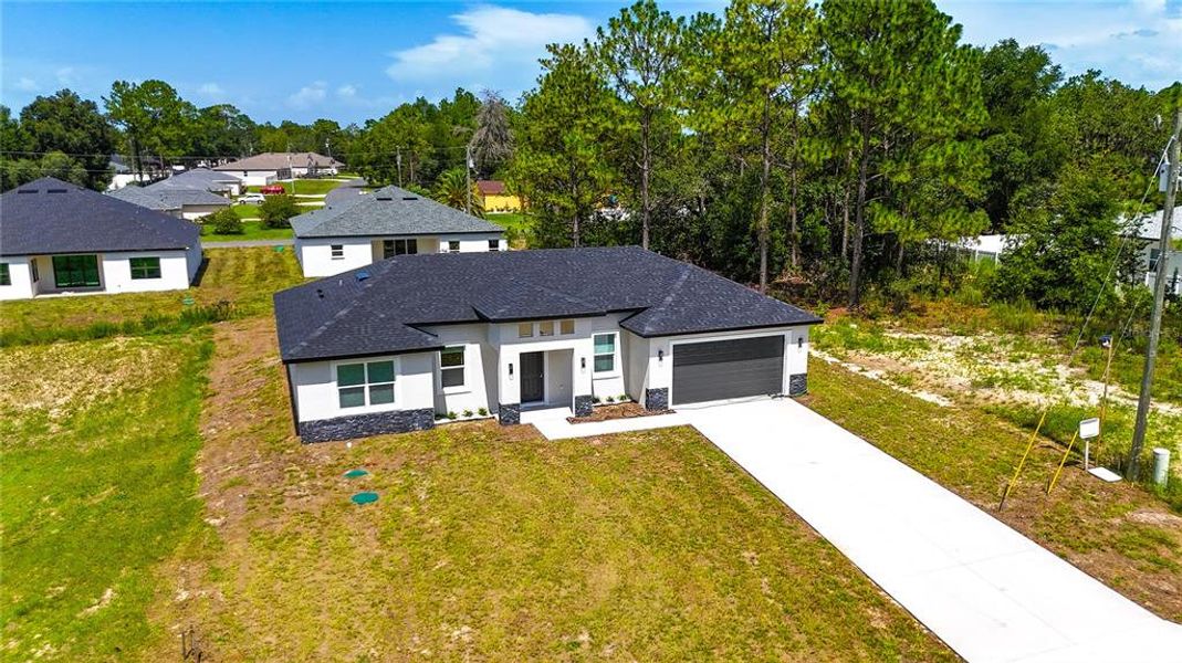 Front exterior of a new home in , Ocala, FL, highlighting curb appeal (Image 24).